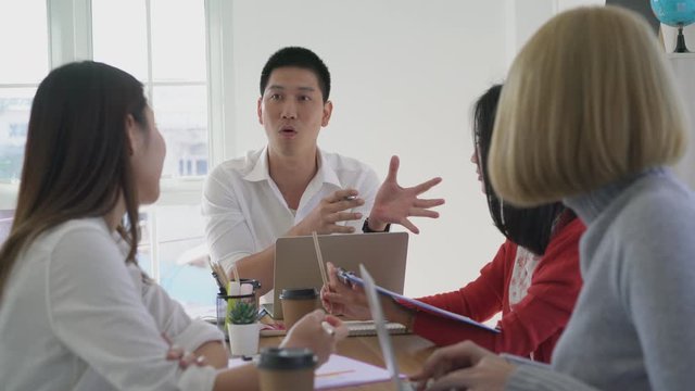 Group of young asian business team meeting in company