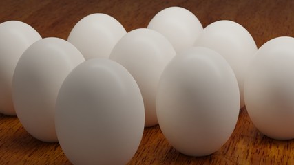 White eggs on a wood table