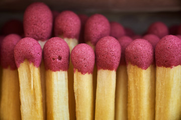 matches in a box with red heads macro photo close-up