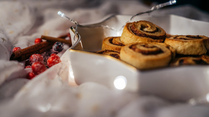  Christmas cinnamon stars on a beautiful plate with decoration and beautiful light - food photography