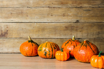 Pumpkins on a wooden background. Halloween concept, harvest, halloween eve