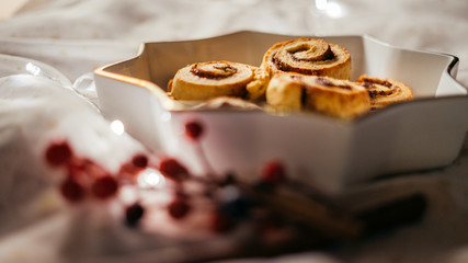  Christmas cinnamon stars on a beautiful plate with decoration and beautiful light - food photography