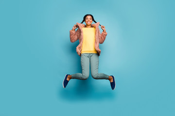Full length body size view of nice attractive trendy funny funky cheerful cheery girl jumping having fun holiday isolated on bright vivid shine vibrant green blue turquoise color background
