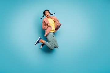 Fototapeta na wymiar Full length body size view of nice attractive fashionable overjoyed cheerful cheery girl jumping having fun time holiday isolated on bright vivid shine vibrant green blue turquoise color background
