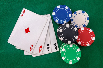 Poker chips with playing cards on table for blackjack. Casino and gambling