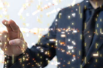 Businessman pressing document icon over computer binary code