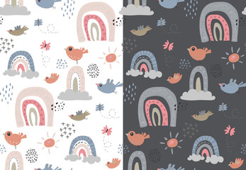 Set of two vector seamless patterns with rainbow, birds, clouds, sun, raindrop. Childish texture for fabric, textile.