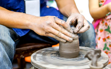 Thailander Demonstration of molding vases with wheel throwing and clay at Chiang Mai, Thailand.