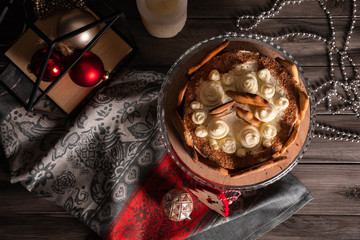 Top view homemade New Year's cherry cake in New Year's entourage