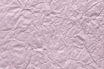 Fototapeta premium Crumpled paper background in gentle lilac color as part of new greeting card.