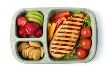 Lunch box with delicious food on a white background