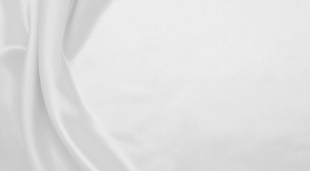 Obraz premium Smooth elegant white silk or satin luxury cloth texture as wedding background. Luxurious background design