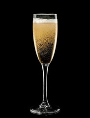 Champagne glass with bubbles on black background