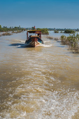 Discover Cambodia and its people and landscape where people live in floating villages and commute on boats. They live from fishing and farming 