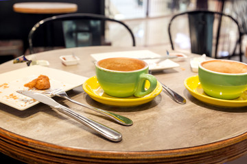  Dirty and empty dishes on the table at cafe.
