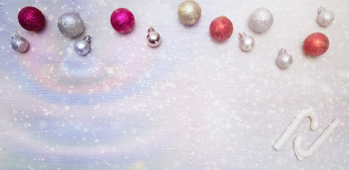 Christmas card with colorful baubles and sugar canes.