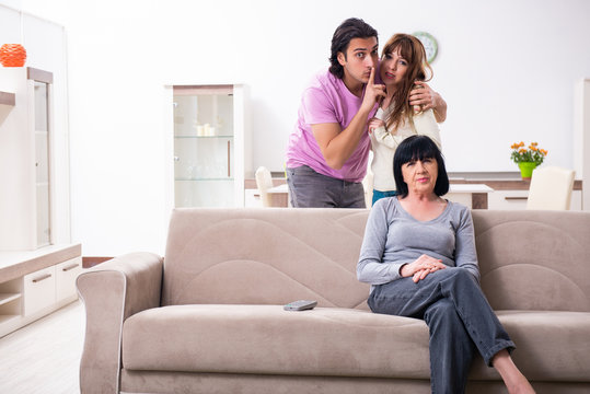 Young Family And Mother-in-law In Family Issues Concept