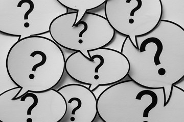 Full frame background of speech bubbles with question marks