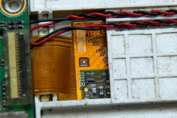 Macro photos showing tablet repair process. Tablet repair under the microscope. Mobile Board: Broken Tablet Board