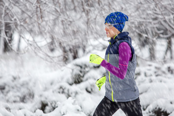 girl running in winter snow scenery
