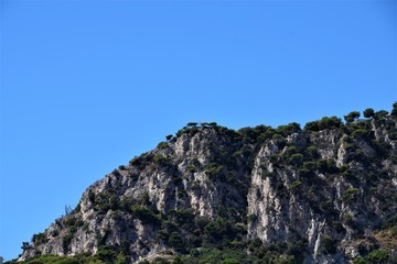 Mountain cliff and blue sky detail