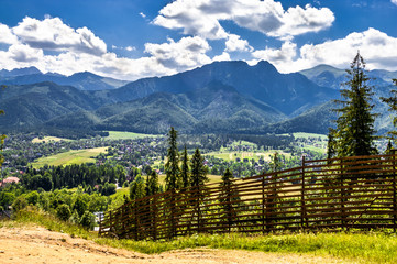 Tatra Mountains, panoramic view from the hiking trail, vista on valley with city in Carpathians