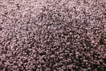 Background fleecy rug beige with black color