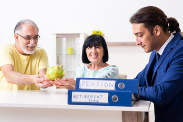Financial advisor giving retirement advice to old couple
