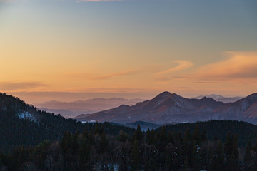 Fototapeta na wymiar Snow country sunset and moon