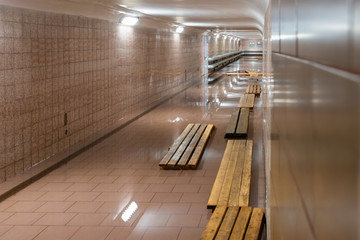 The underpass has flooded and water covers the entire space