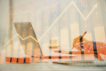 Double exposure of forex chart with man working on computer on background. Concept of market analysis.