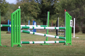 Fototapeta na wymiar Image of show jumping poles on empty training field.