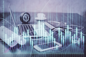 Stock market graph and table with computer background. Double exposure. Concept of financial analysis.