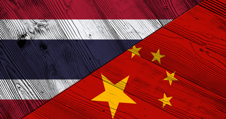 Flag of Thailand and China on wooden boards