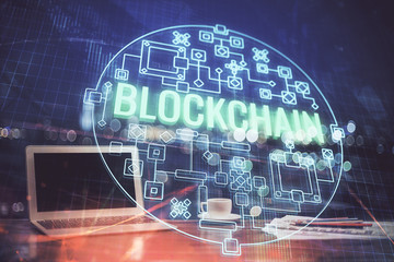 Multi exposure of blockchain theme hologram and table with computer background. Concept of bitcoin...