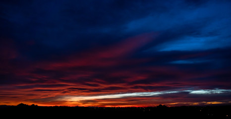 Fototapeta na wymiar Beautiful sunset sky with dramatic light and vibrant color.