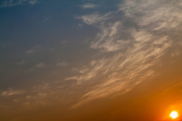 Naklejka na ściany i meble Colorful cloudy sky during the sunset