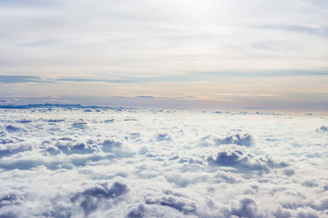 Clouds and sky as seen through window of an aircraft