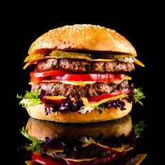 Homemade double cheese burger Black background - obrazy, fototapety, plakaty