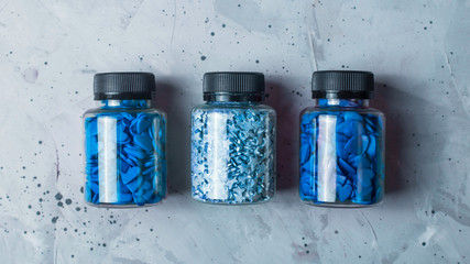 Confectionery powder blue stars and hearts in jars.