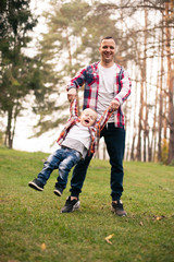 Fototapeta premium Father and son together in forest