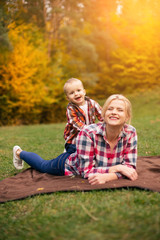 Fototapeta premium Family on weekend. Mother father and son in park