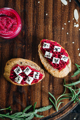 Canapes with horseradish and feta cheese sprinkled with sesame seeds. Appetizer for strong alcohol