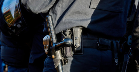 close-up of Baton on the belt of a German policeman in black uniform