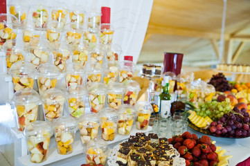 Dessert table of delicious fruits on wedding reception.