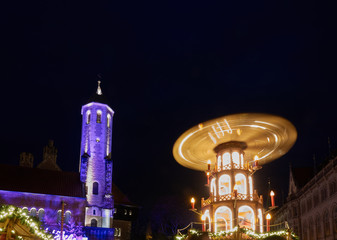 Night shot of the rotating Christmas pyramid on a German Christmas market, with the illuminated...