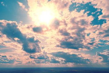 Colorful cloudy sky at sunset. Aerial view. Sky texture, abstract nature background