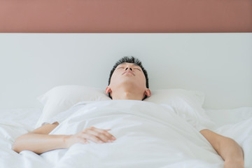 Obraz na płótnie Canvas top view of bearded man sleeping on bed