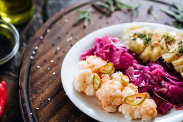 Choucroute, barrel broccoli. Cold snack for alcohol served on a wooden board