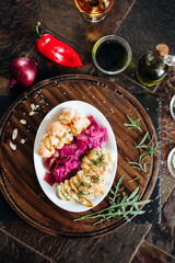 Choucroute, barrel broccoli. Cold snack for alcohol served on a wooden board